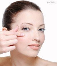 close up of woman's hands on face