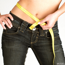 woman measuring stomach