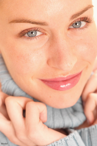 happy woman in turtleneck