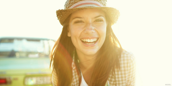 smiling woman in sun