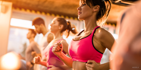 Woman exercising to maintain her liposuction results.