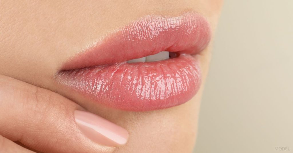 A close-up shot of full lips. (Model)