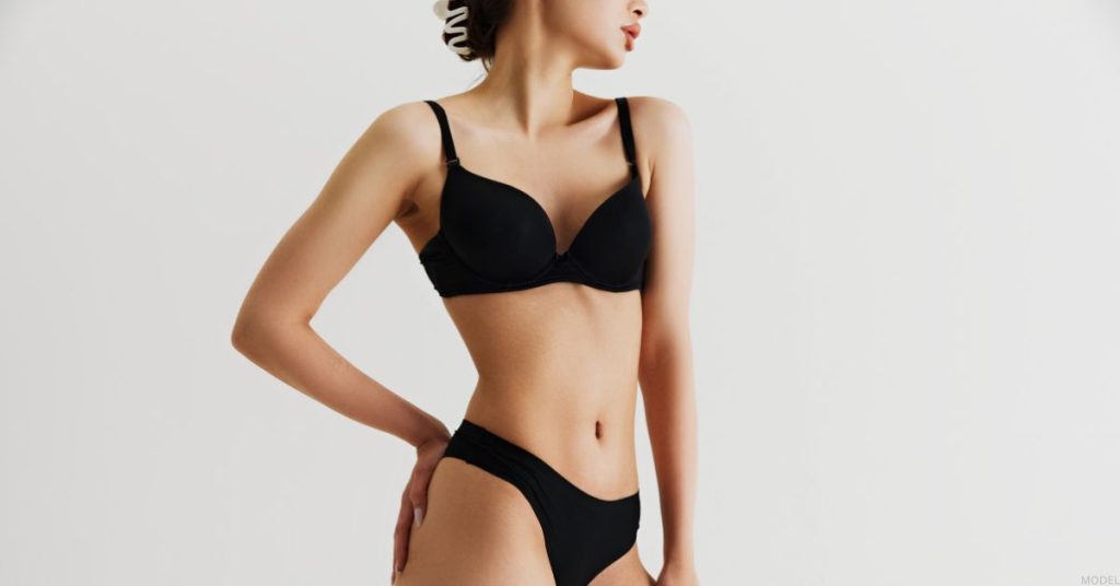 Model posing in black underwear